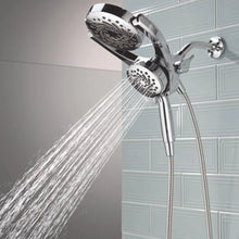 Chrome hand shower with water jet spray from upper and lower spray heads
