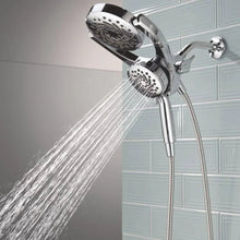 Chrome dual spray hand shower with two heads, water flowing from nozzles