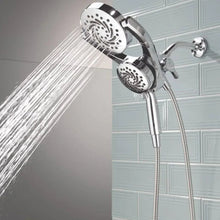Chrome shower hand set with overhead and handheld spray heads, water stream