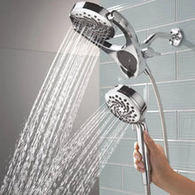 Chrome dual-head hand shower spraying water from two round nozzles