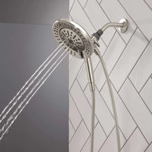 Hand shower with round spray head delivering multiple droplets, wall mount and hose
