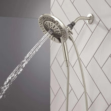 Hand shower with round spray head and steady water stream, chrome finish, flexible hose
