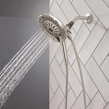 Hand shower with round spray head sending fan spray, chrome finish, flexible hose