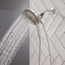 Hand shower with round spray head emitting water stream, chrome finish, flexible hose
