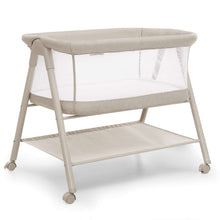 Tan airflow bassinet with open lower shelf and caster wheels, front view