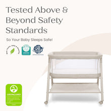 Tan bassinet with breathable mesh sides on caster wheels, safety-certified frame