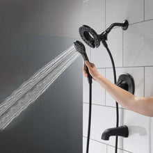 Black handheld shower head spraying a steady water stream from a flexible hose