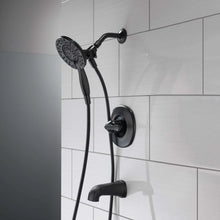 Delta shower faucet with black showerhead, flexible hose, wall mount and spout
