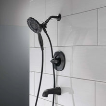 Black shower faucet set with overhead shower head and wall-mounted control