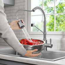 Hand pulling spray head of high arc pull-down kitchen faucet from stainless sprayer