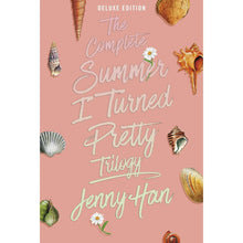 Paperback book with pink cover, seashells, and handwritten-style title text
