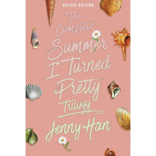 Deluxe edition paperback book cover, pink with shells and title lettering