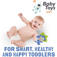 Baby playing with blue monkey shaker rattle and teether