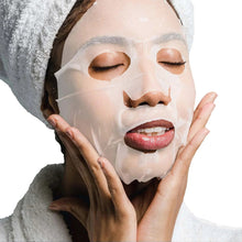 Person wearing translucent silk sheet mask with hands near face