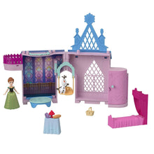 Pink and purple castle dollhouse with blue roof, front door, and Olaf figure accessory