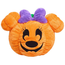 Orange Mickey pumpkin head plush with purple bow and green stem, black cartoon face