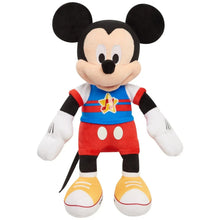 Singing Mickey Mouse plush toy with blue shirt, red shorts, and black ears