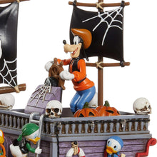 Donald Duck on pirate ship deck figurine with black sail, skulls, and jack-o-lanterns