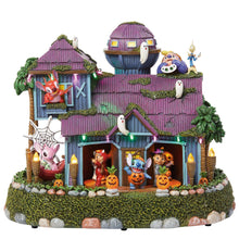 Halloween animated house with purple shingle roof, jack-o'-lanterns, and lit porch.
