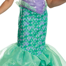 Green scale-print skirt with purple waistband and mint ruffle trim