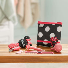 Baby Minnie grooming set on a table with pink comb, brush, and black polka-dot pouch