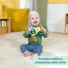 Busy bear activity toy with colorful bead bars and rattle, held in baby’s hands