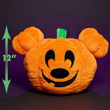 Orange Mickey pumpkin head plush with green stem and black smile face, rounded ears