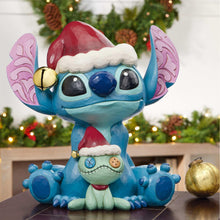 Stitch and Scrump holiday statue with blue body, Santa hat, and stitched belly