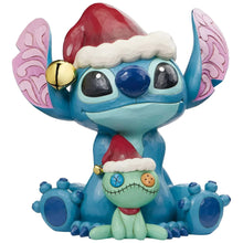 Stitch and Scrump holiday statue with Santa hat, large eyes, and pink wing details