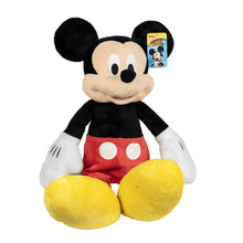 Large Mickey Mouse plush toy with black head, red shorts, yellow feet, and round ears