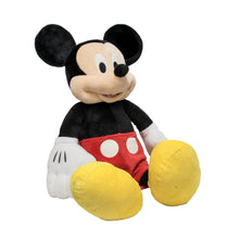Large Mickey Mouse plush toy with smiling face, black body, red shorts, yellow arms and feet