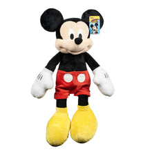Large Mickey Mouse plush toy in black outfit with red shorts, white gloves, yellow feet