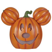 Orange Mickey jack-o-lantern pumpkin with gray glitter eyes and smiling mouth