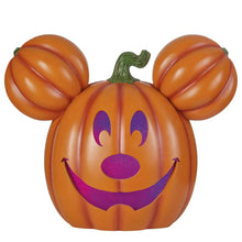 Orange Mickey-style jack-o-lantern pumpkin with green stem and purple glitter face
