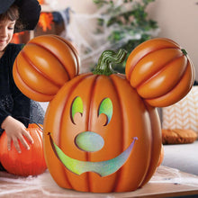 Orange Mickey jack-o-lantern pumpkin with green glitter eyes, nose and smile