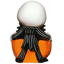 Skellington treat bowl with white round skull top, black scarf, and orange body