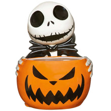 Skellington treat bowl with white skull head and orange jack-o'-lantern face