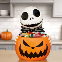 Skellington treat bowl: orange pumpkin face with white skull top and black outfit wrap