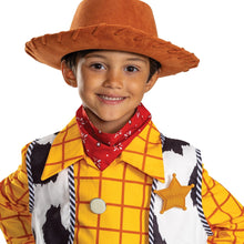 Children’s Woody-style costume close-up with brown hat, yellow plaid shirt, red bandana