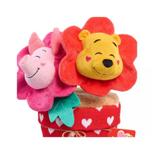 Close-up valentine potted plush with Pooh and Piglet flowers over red heart fabric pot