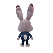 Grey bunny plush from behind, long ears up, dark blue jacket and pants