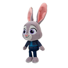 Grey bunny plush standing, pink inner ears, dark blue jacket and pants