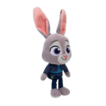 Grey bunny plush with long pink ears, wearing a dark blue jacket and pants