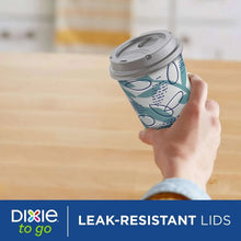 Paper to-go cup with gray leak-resistant lid and teal-and-blue abstract pattern.