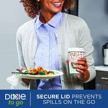 Hot to-go cup with white domed lid held in hand