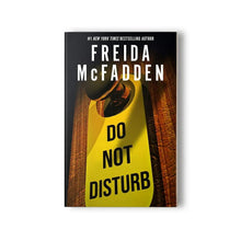 Paperback book cover with yellow door sign reading "DO NOT DISTURB" by Freida McFadden
