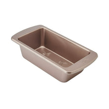 Rose-gold carbon steel loaf pan with butterfly embossing on interior base