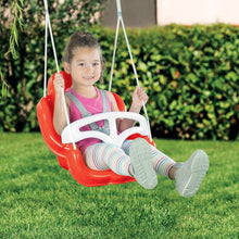 Red toddler swing seat suspended on four white ropes, with a child in a harness