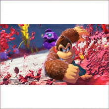 Nintendo Switch 2 gameplay scene with Donkey Kong swinging through colorful debris