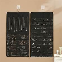 Black double-sided hanging jewelry organizer with metal hooks and earring compartments